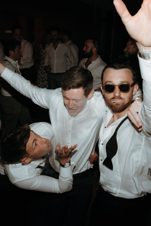 Wedding party guests going crazy at a wedding party at La Villa Starnberg, wedding photo by photographer Stories by Toni